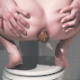 A girl squats over the edge of a closed commode and shits onto the bathroom floor. The heap of poop is shown at the end of the clip. Presented in 720P HD. Over 2 minutes.